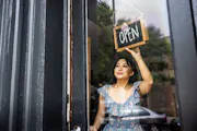 Woman opening shop