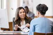Loan officer going over paperwork